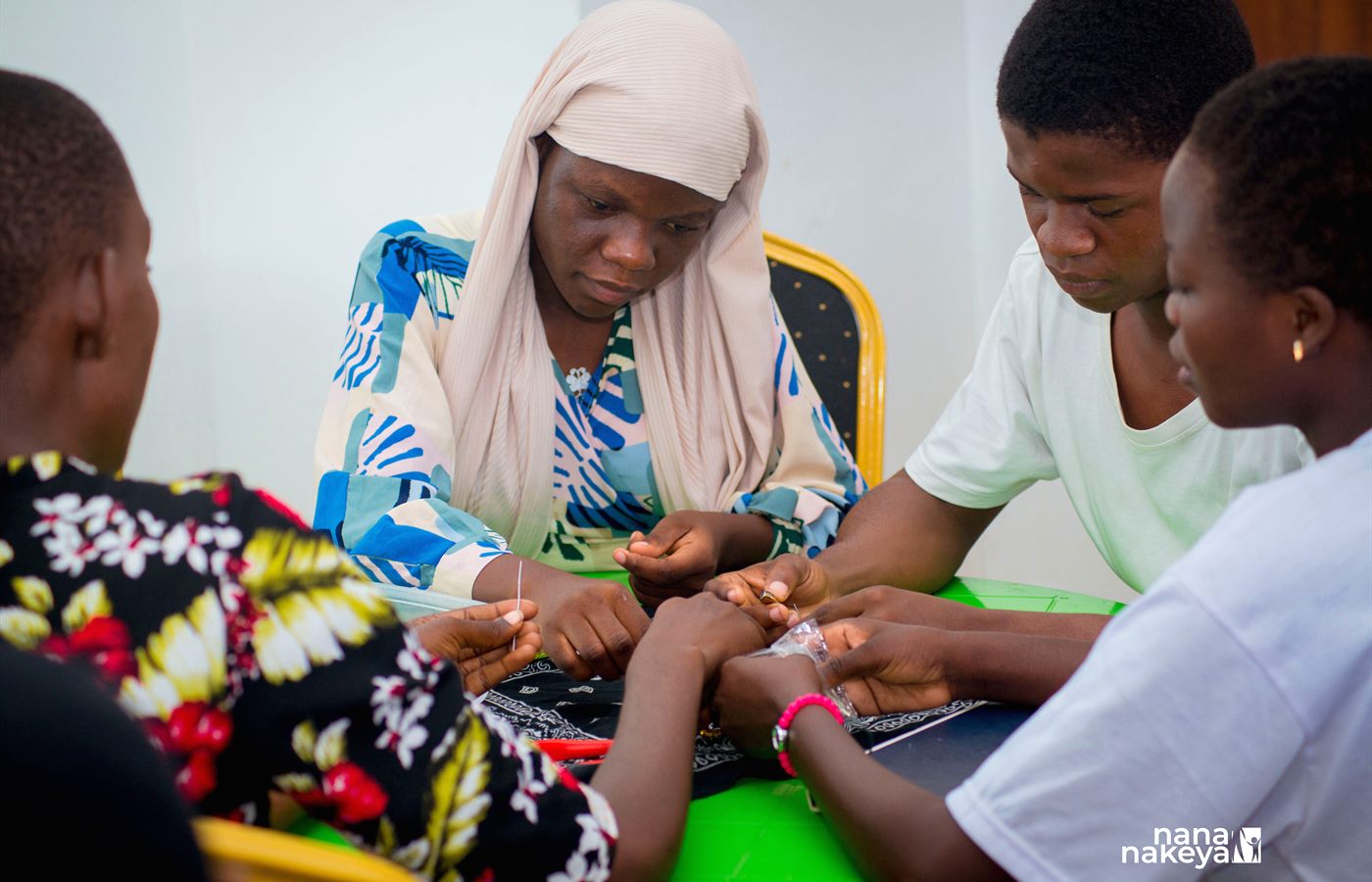 Children and a mentor combining science with practical gardening