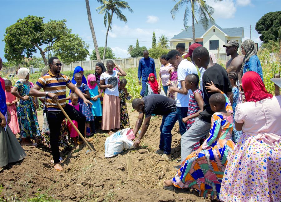 Children and community members during a Jembekuza planting activity